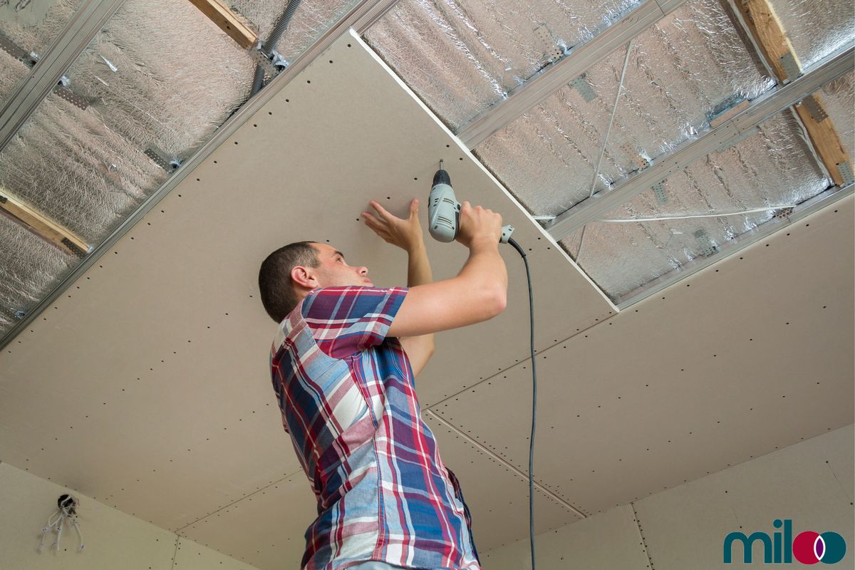 Reflective insulation being stapled to framing